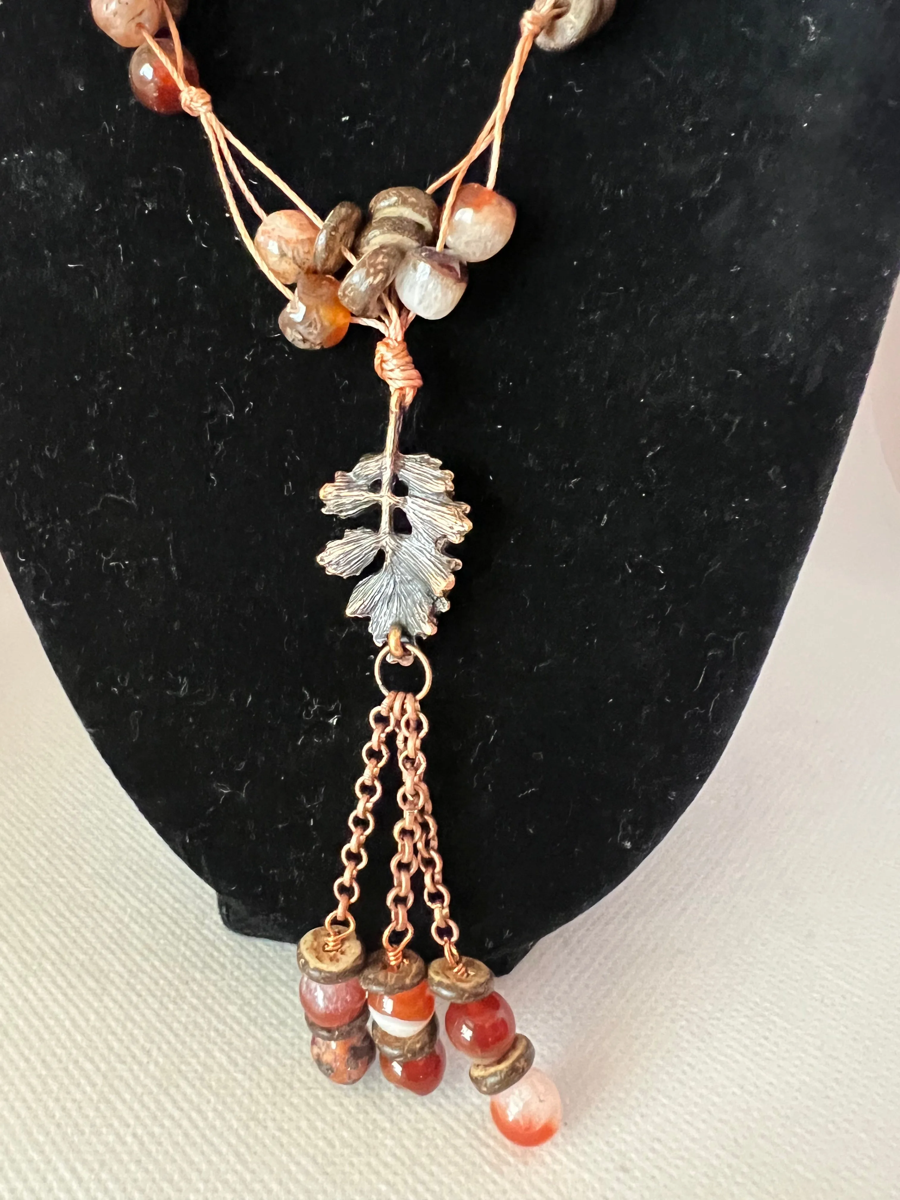 28 inch Knotted Cord Necklace with Coconut Shell Wood, Copper Leaf and Red Agate